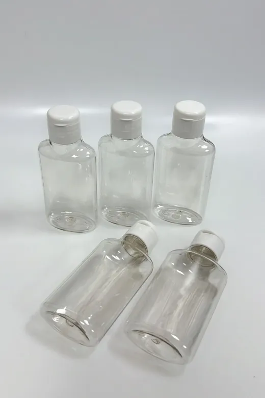 DEKOZOR COMPANY TYBIQQ1RMWS3U63065 5Li Şeffaf 100Ml Plastik Fliptop Kapaklı Şişe Seyahat Seti Boş Şişe
